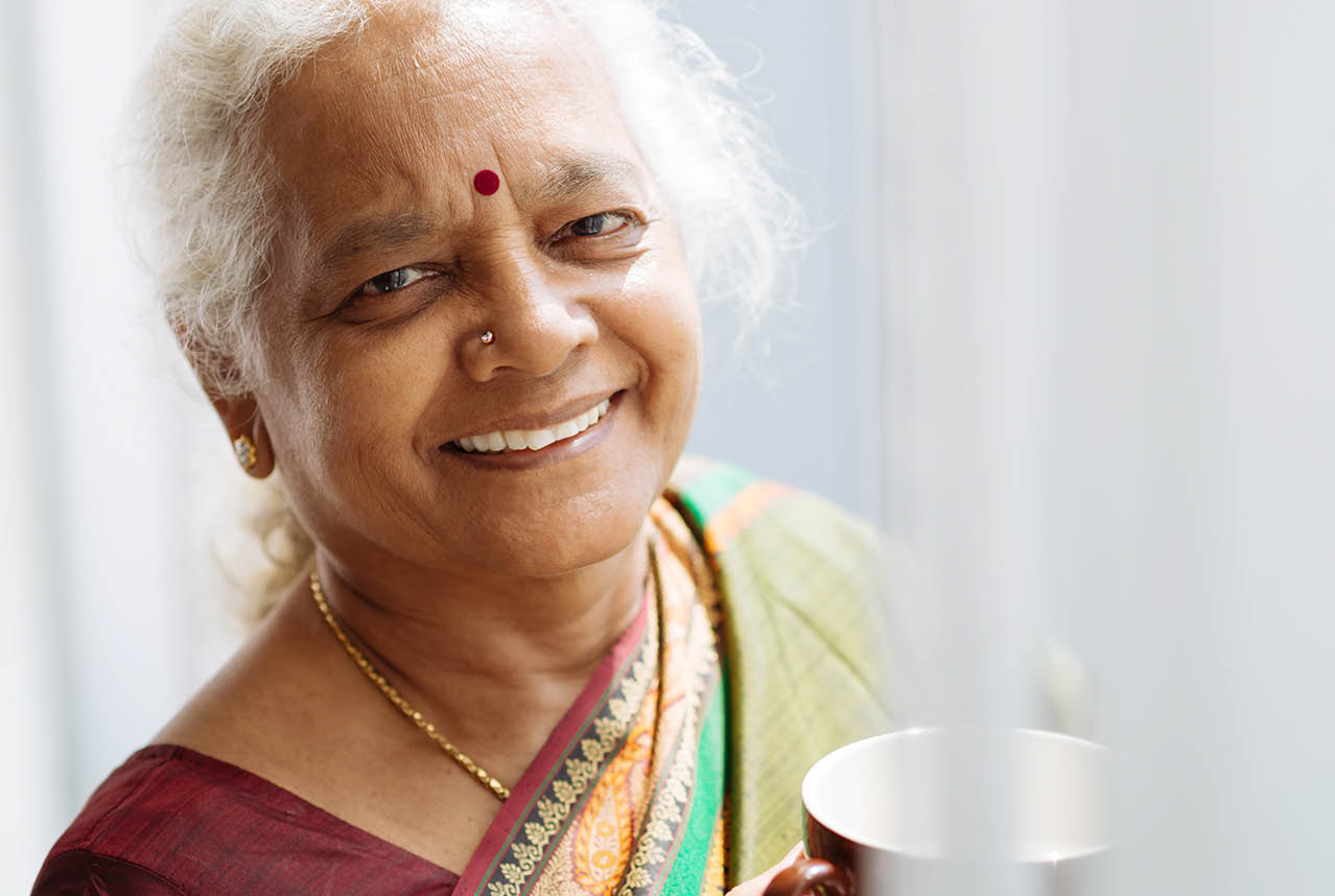Senior woman drinking from a mug